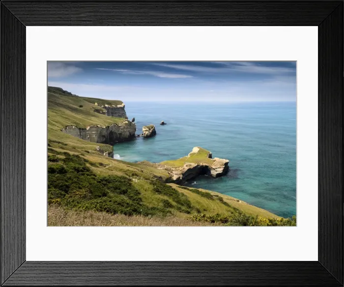 Framed Print : Rocky cliffs on the Pacific coast at Tunnel Beach, Dunedin, Otago Region, South Island, New Zealand Framed Print : Rocky cliffs on the Pacific coast at Tunnel Beach, Dunedin, Otago Region, South Island, New Zealand