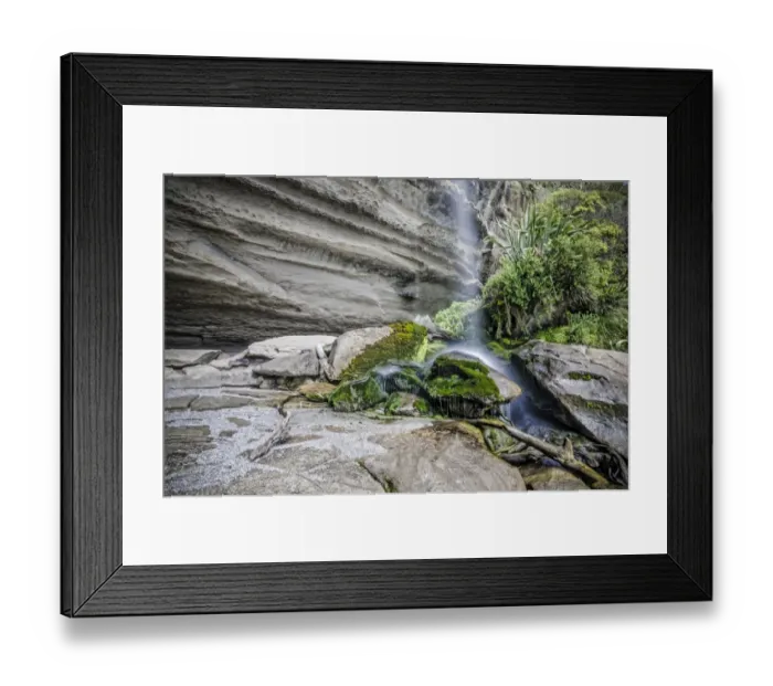 Framed Print : Rock formations of Trumans Cove at the beach with a waterfall, Te Miko, Trumans Bay, Paparoa National Park, Punakaiki, South Island, New Zealand, Oceania
