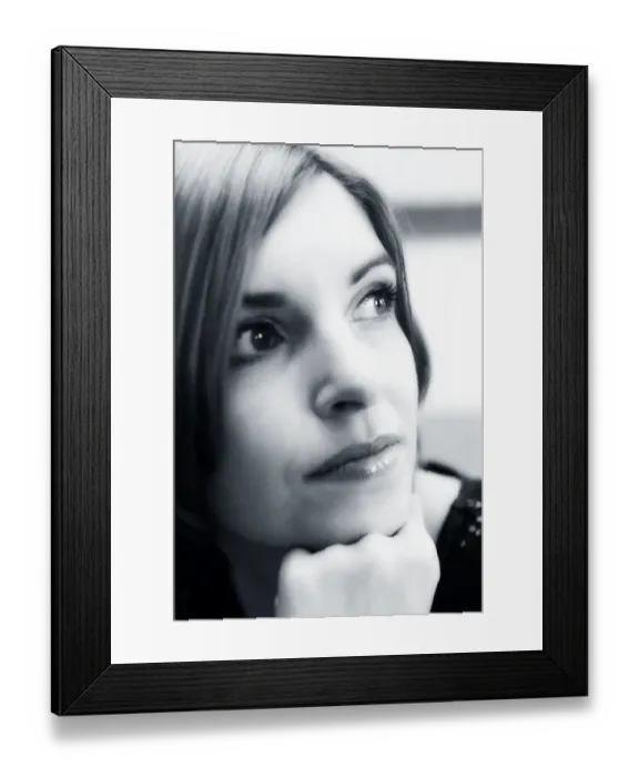 Framed Print : Young woman supporting her chin on her hand, portrait Framed Print : Young woman supporting her chin on her hand, portrait