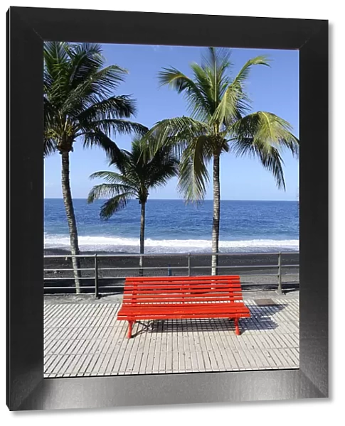 Red park bench on the beach promenade of Puerto Naos, La Palma, Canary Islands, Canary Islands, Spain, Europe, PublicGround