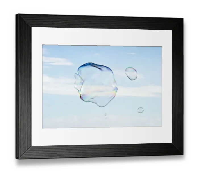 Framed Print : Large soap bubbles in front of a bright blue sky Framed Print : Large soap bubbles in front of a bright blue sky