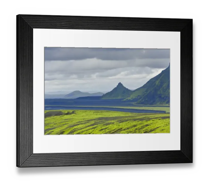 Framed Print : Hills covered with moss in front of an area with black sand and a pointed mountain, view from the road into the Pakgil or Thakgil Valley, Iceland
