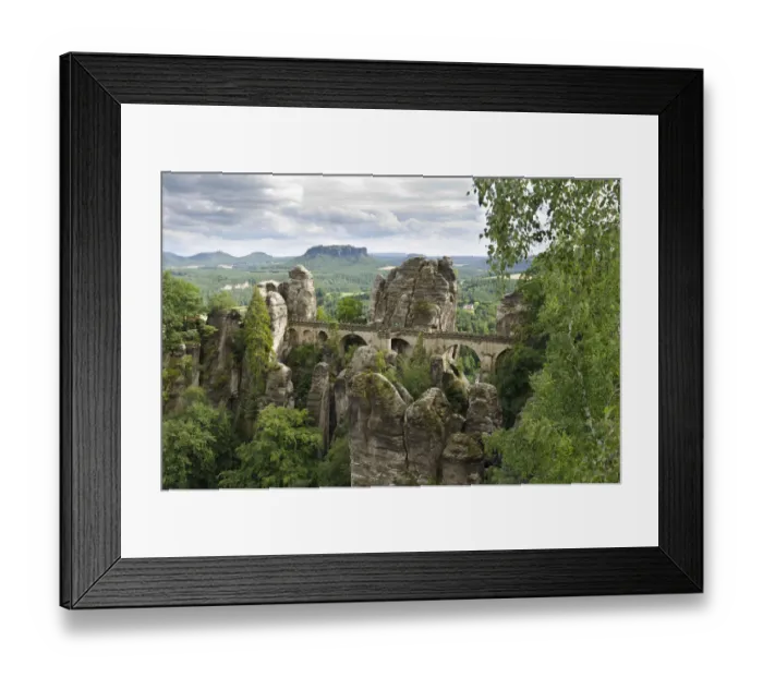 Framed Print : View of the rocks of the Bastei and the Basteibruecke bridge, behind Mt. Lilienstein, Elbe Sandstone Mountains, Saxony, Germany, Europe Framed Print : View of the rocks of the Bastei and the Basteibruecke bridge, behind Mt. Lilienstein, Elbe Sandstone Mountains, Saxony, Germany, Europe