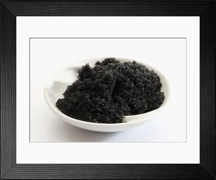 Framed Print : Black Hawaiian sea salt in a small porcelain bowl