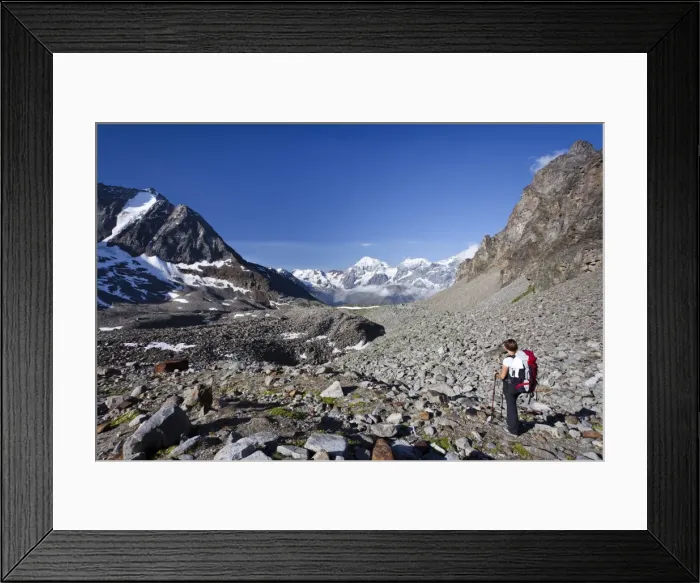 Framed Print : Hiker during ascent of Mt Tschenglser Hochwand above Duesseldorfer Huette hut in Sulden, Mt Vertainspitze, Mt Koenigsspitze and Mt Zebru at back, Suldental valley, South Tyrol, Italy, Europe