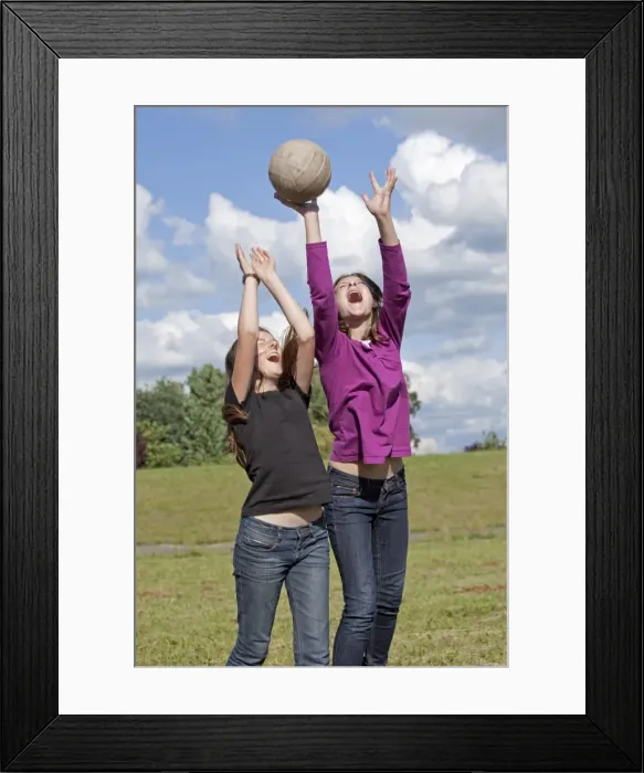 Framed Print : Two girls playing wth ball