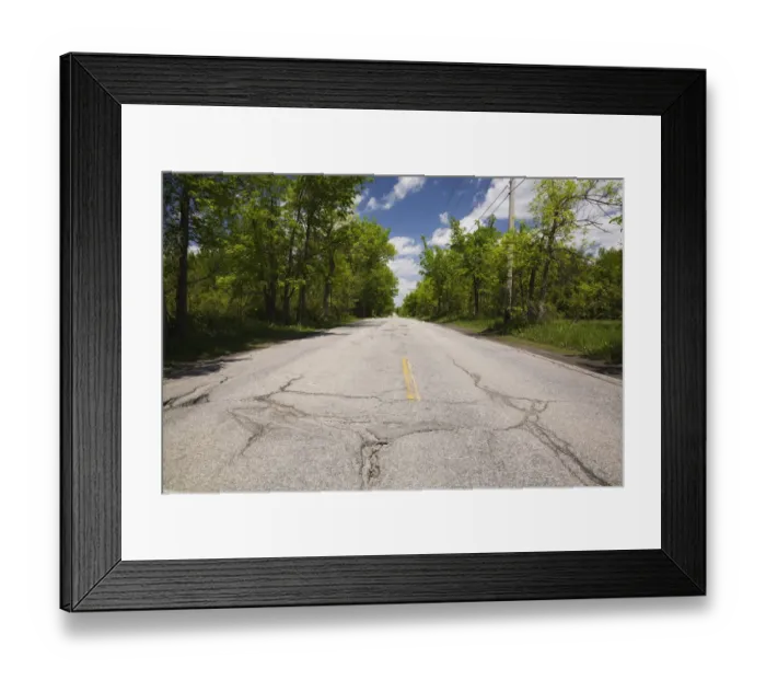 Framed Print : Asphalt road with pothole in the countryside, Quebec, Canada Framed Print : Asphalt road with pothole in the countryside, Quebec, Canada