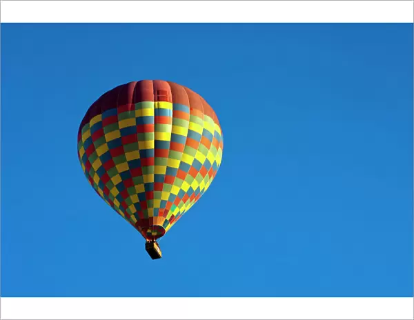 Hot air balloon in the blue sky, Goreme, Cappadocia, Nevsehir Province, Central Anatolia Region, Turkey