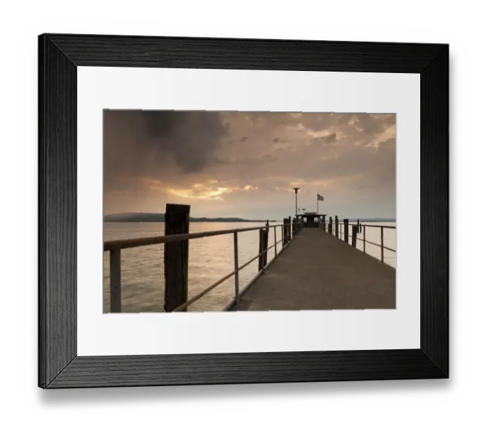 Framed Print : Lake Constance and approaching thunder clouds in the evening, pier in Mannenbach, Switzerland, Europe Framed Print : Lake Constance and approaching thunder clouds in the evening, pier in Mannenbach, Switzerland, Europe