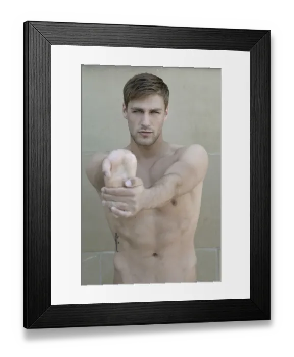 Framed Print : Portrait of a young bare-chested man, stretching his hand Framed Print : Portrait of a young bare-chested man, stretching his hand