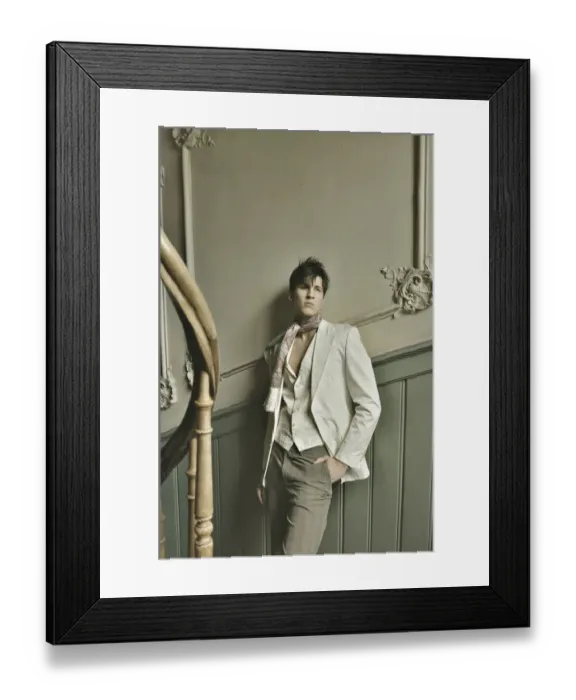 Framed Print : Young man standing in an old stairwell, nostalgia Framed Print : Young man standing in an old stairwell, nostalgia