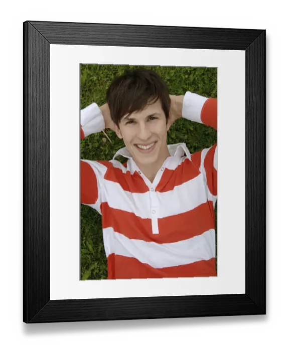 Framed Print : Young man lying on a meadow Framed Print : Young man lying on a meadow