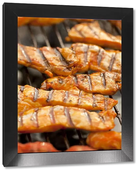 Grilled meat, marinated turkey breast on a grill