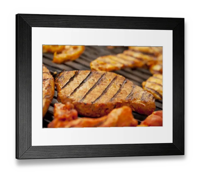Framed Print : Grilled meat, marinated turkey breast and beef steaks on a grill