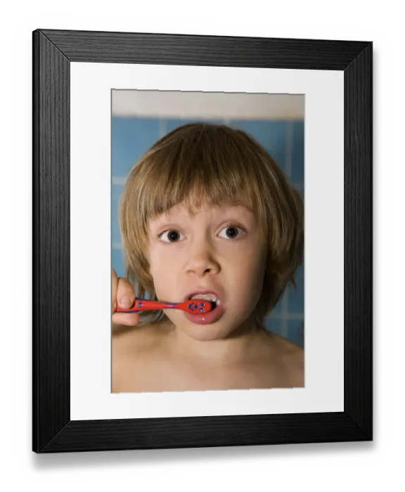 Framed Print : Four-year-old blond boy brushing his teeth Framed Print : Four-year-old blond boy brushing his teeth