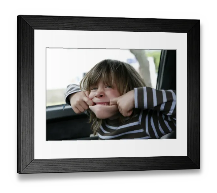 Framed Print : Boy, 5, making a grimace Framed Print : Boy, 5, making a grimace