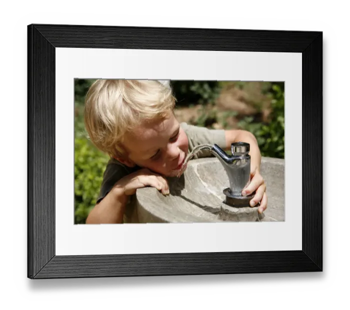 Framed Print : Boy, three years, drinking water from a public tap, Spain, Europe Framed Print : Boy, three years, drinking water from a public tap, Spain, Europe
