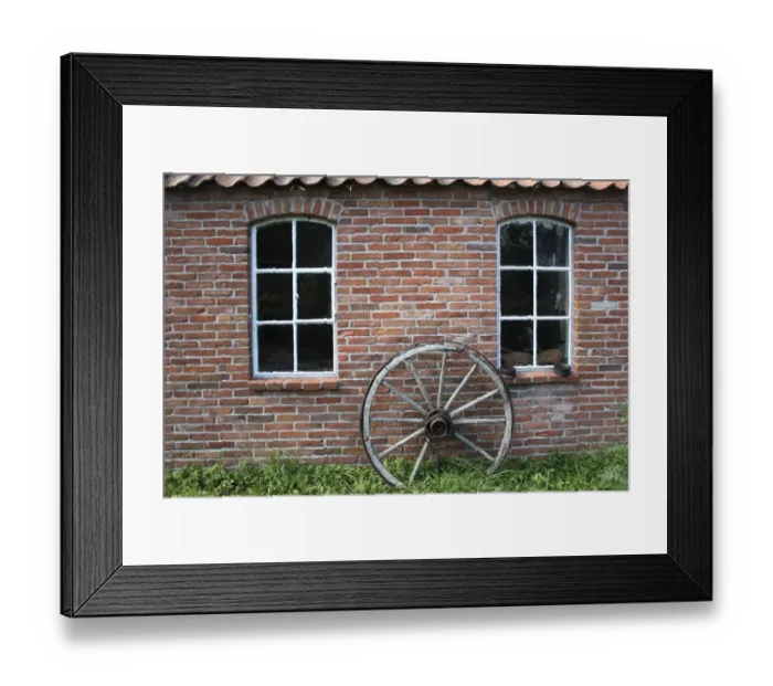Framed Print : Old wagon wheel on a facade, brick stone, East Frisia, Lower Saxony, Germany, Europe Framed Print : Old wagon wheel on a facade, brick stone, East Frisia, Lower Saxony, Germany, Europe