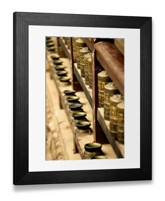 Framed Print : A row of prayer mills and butter lamps in the Golden Temple, a Buddhist temple, Patan, Nepal, Asia Framed Print : A row of prayer mills and butter lamps in the Golden Temple, a Buddhist temple, Patan, Nepal, Asia