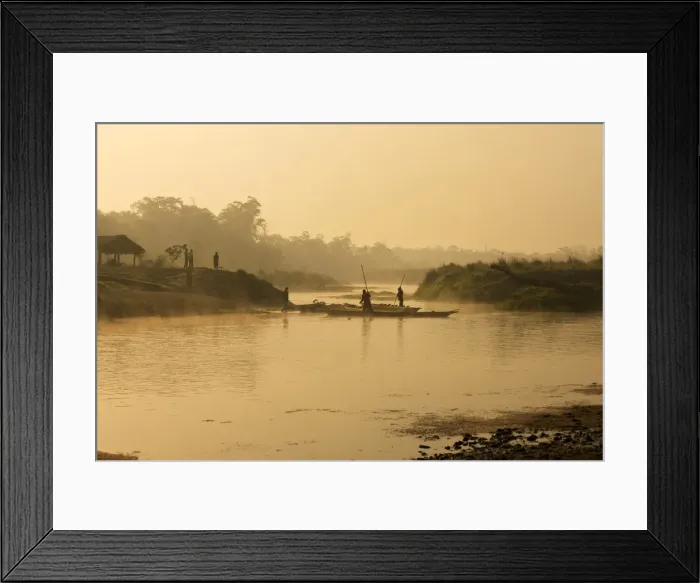 Framed Print : Dugout canoe with punting ferryman crossing a small river early in the morning, rising sun and fog, Chitwan National Park, Nepal, Asia Framed Print : Dugout canoe with punting ferryman crossing a small river early in the morning, rising sun and fog, Chitwan National Park, Nepal, Asia