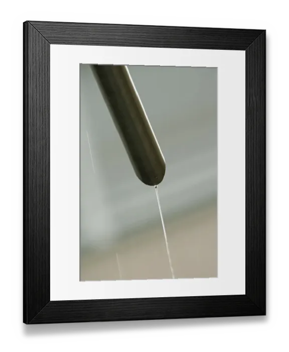 Framed Print : Rain water flowing from a drain pipe Framed Print : Rain water flowing from a drain pipe