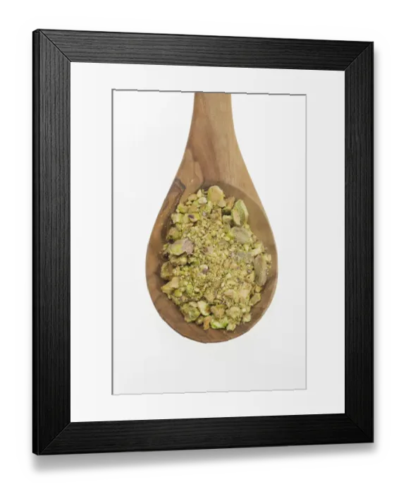 Framed Print : Chopped Pistachio (Pistacia vera) nuts on an olive wood spoon Framed Print : Chopped Pistachio (Pistacia vera) nuts on an olive wood spoon