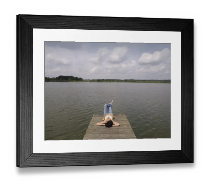 Framed Print : Woman relaxing lying on a wooden pier at a lake, Mecklenburg Lake District, Mecklenburg-Western Pomerania, Germany, Europe Framed Print : Woman relaxing lying on a wooden pier at a lake, Mecklenburg Lake District, Mecklenburg-Western Pomerania, Germany, Europe