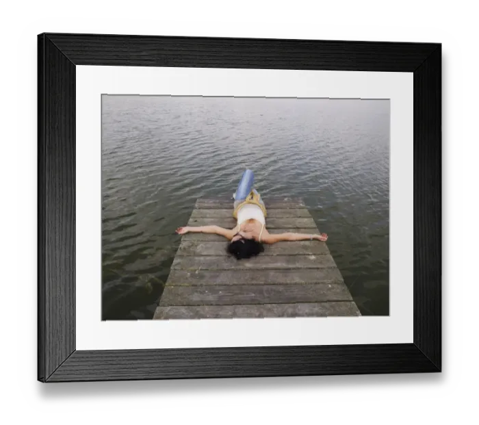 Framed Print : Woman relaxing lying on a wooden pier at a lake, Mecklenburg Lake District, Mecklenburg-Western Pomerania, Germany, Europe Framed Print : Woman relaxing lying on a wooden pier at a lake, Mecklenburg Lake District, Mecklenburg-Western Pomerania, Germany, Europe
