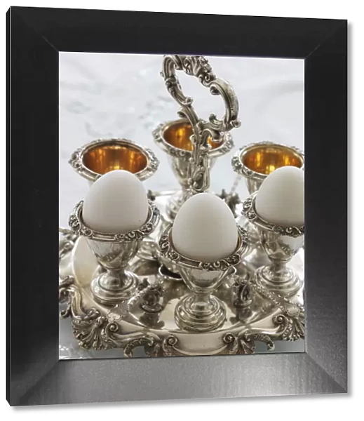Antique silver egg cups in a sophisticated environment