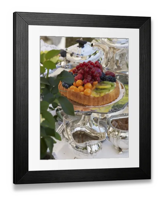 Framed Print : Fruit pie on antique, silver cake plate in a luxurious ambience of a stylishly set coffee table Framed Print : Fruit pie on antique, silver cake plate in a luxurious ambience of a stylishly set coffee table