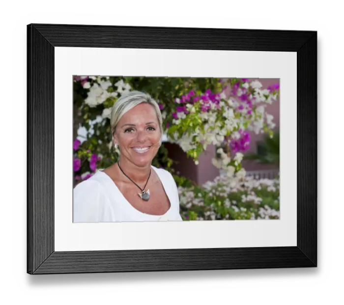 Framed Print : Portrait of a forty-year-old woman in front of flowers