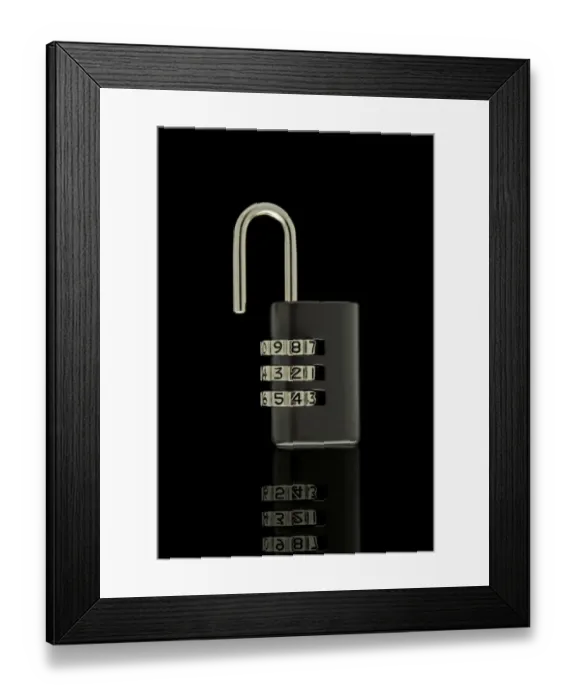 Framed Print : Black unlocked combination lock on black