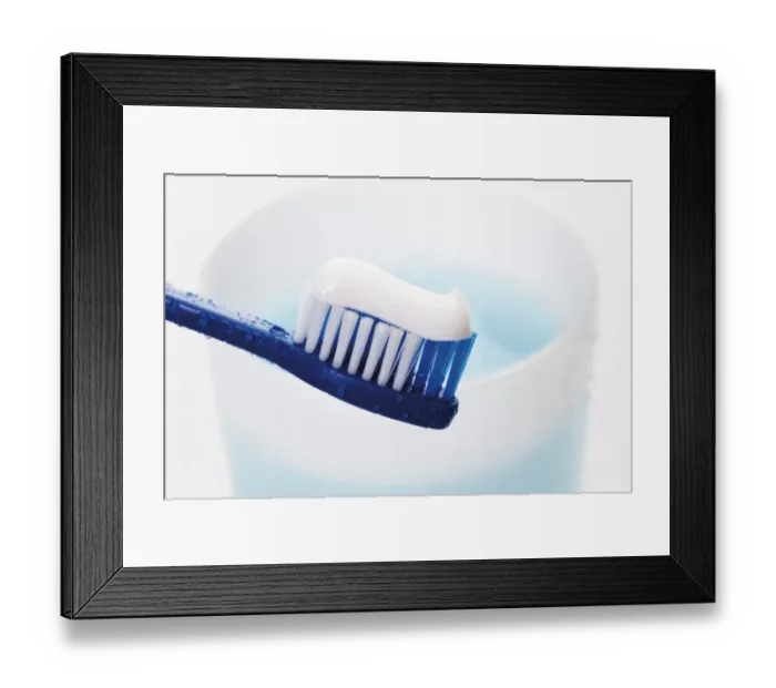 Framed Print : Toothbrush with toothpaste in front of a toothbrush tumbler with mouthwash Framed Print : Toothbrush with toothpaste in front of a toothbrush tumbler with mouthwash