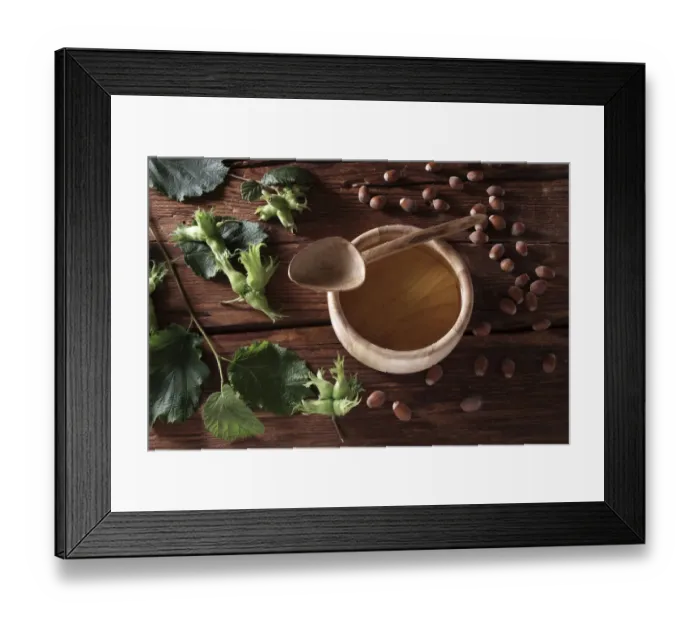 Framed Print : A bowl of hazelnut oil and some ripe and unripe hazelnuts (Corylus avellana) on rustic wooden boards Framed Print : A bowl of hazelnut oil and some ripe and unripe hazelnuts (Corylus avellana) on rustic wooden boards