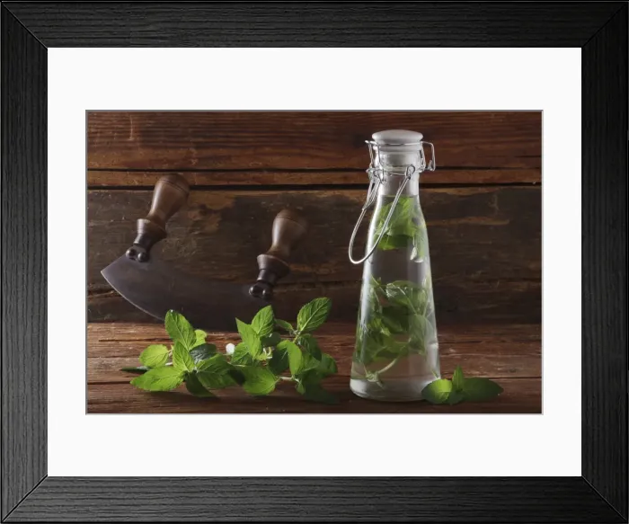 Framed Print : Pepperming leaves (Mentha piperita), preparation for making medicine or liquor, on a rustic wooden underground