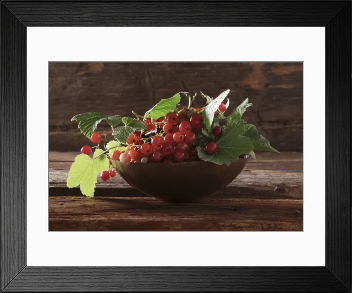 Framed Print : A bowl with red currants (Ribes rubrum) on a wooden background