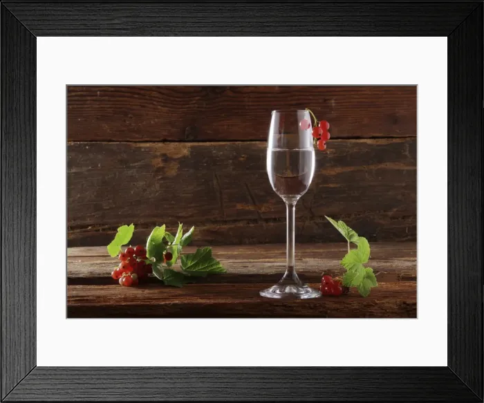 Framed Print : A glass of red currant schnapps with red currants (Ribes rubrum) on wooden background Framed Print : A glass of red currant schnapps with red currants (Ribes rubrum) on wooden background