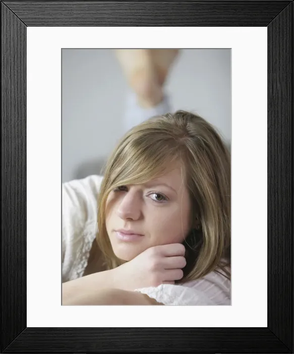Framed Print : Young woman lying on the couch Framed Print : Young woman lying on the couch
