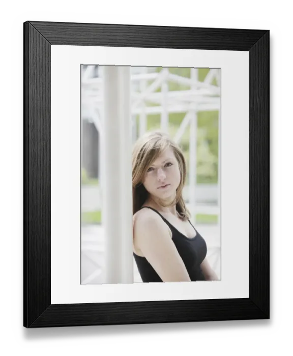 Framed Print : Sensual portrait of a young long-haired woman in front of metal construction Framed Print : Sensual portrait of a young long-haired woman in front of metal construction