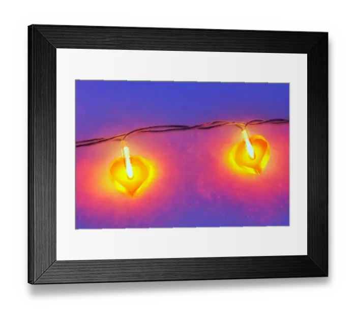 Framed Print : Lit heart-shaped fairy lights in the snow Framed Print : Lit heart-shaped fairy lights in the snow