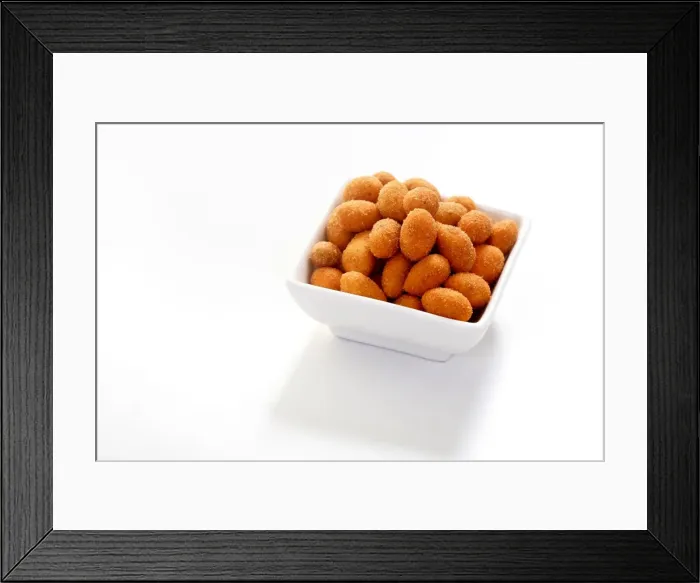 Framed Print : Peanuts in a paprika flavoured coating, in a bowl Framed Print : Peanuts in a paprika flavoured coating, in a bowl