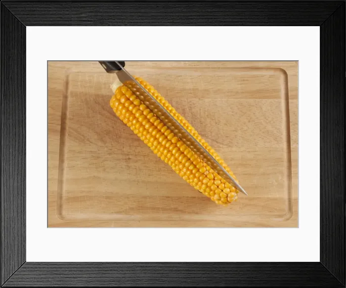 Framed Print : Corn or maize cob with kitchen knife Framed Print : Corn or maize cob with kitchen knife