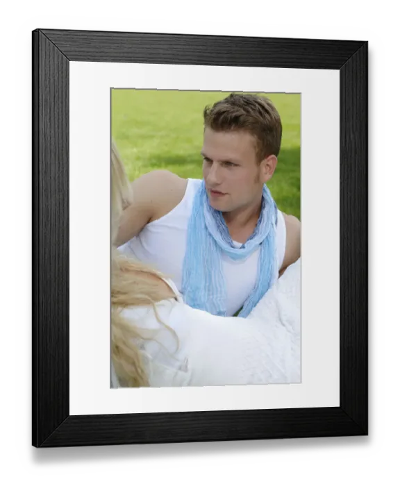 Framed Print : Young man in the arms of a woman on a lawn Framed Print : Young man in the arms of a woman on a lawn