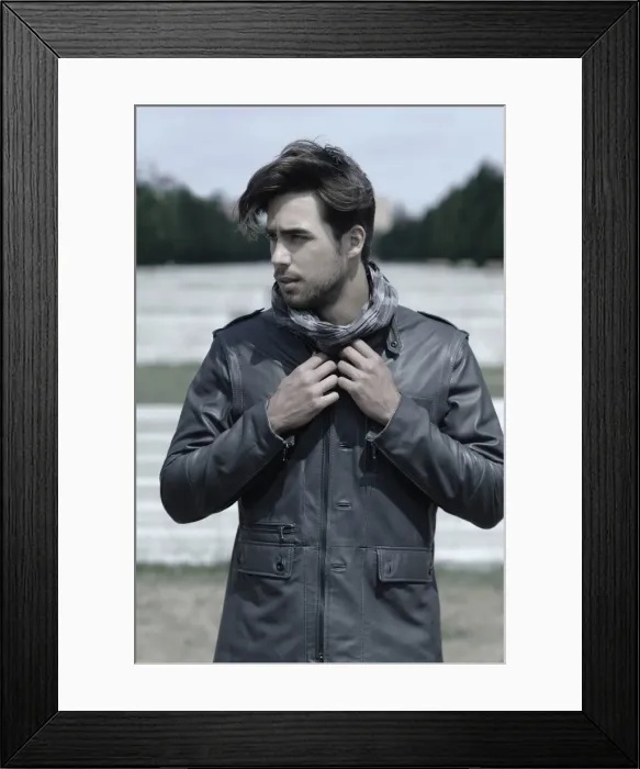 Framed Print : Young man wearing a leather jacket in front of an open staircase, portrait Framed Print : Young man wearing a leather jacket in front of an open staircase, portrait