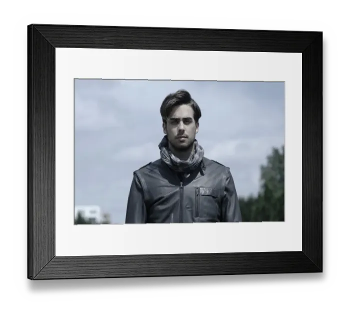 Framed Print : Young man wearing a leather jacket, portrait Framed Print : Young man wearing a leather jacket, portrait