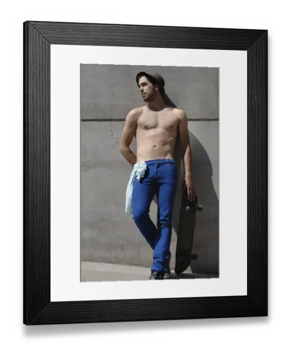 Framed Print : Young shirtless skater in front of a concrete wall Framed Print : Young shirtless skater in front of a concrete wall