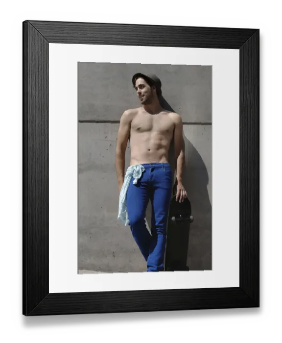 Framed Print : Young shirtless skater in front of a concrete wall Framed Print : Young shirtless skater in front of a concrete wall