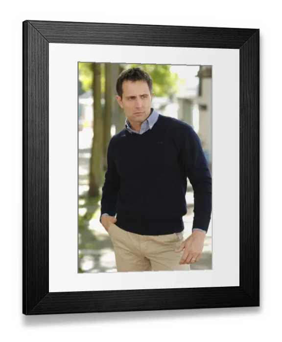 Framed Print : Man wearing casual clothes standing in an avenue Framed Print : Man wearing casual clothes standing in an avenue