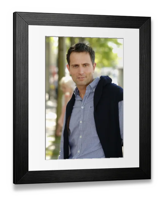 Framed Print : Man wearing casual clothes standing in an avenue Framed Print : Man wearing casual clothes standing in an avenue