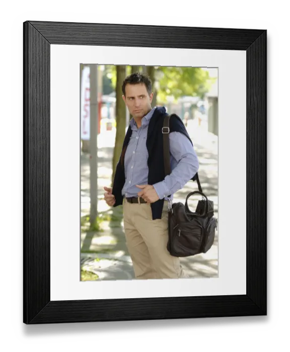 Framed Print : Man wearing casual clothes standing in an avenue Framed Print : Man wearing casual clothes standing in an avenue
